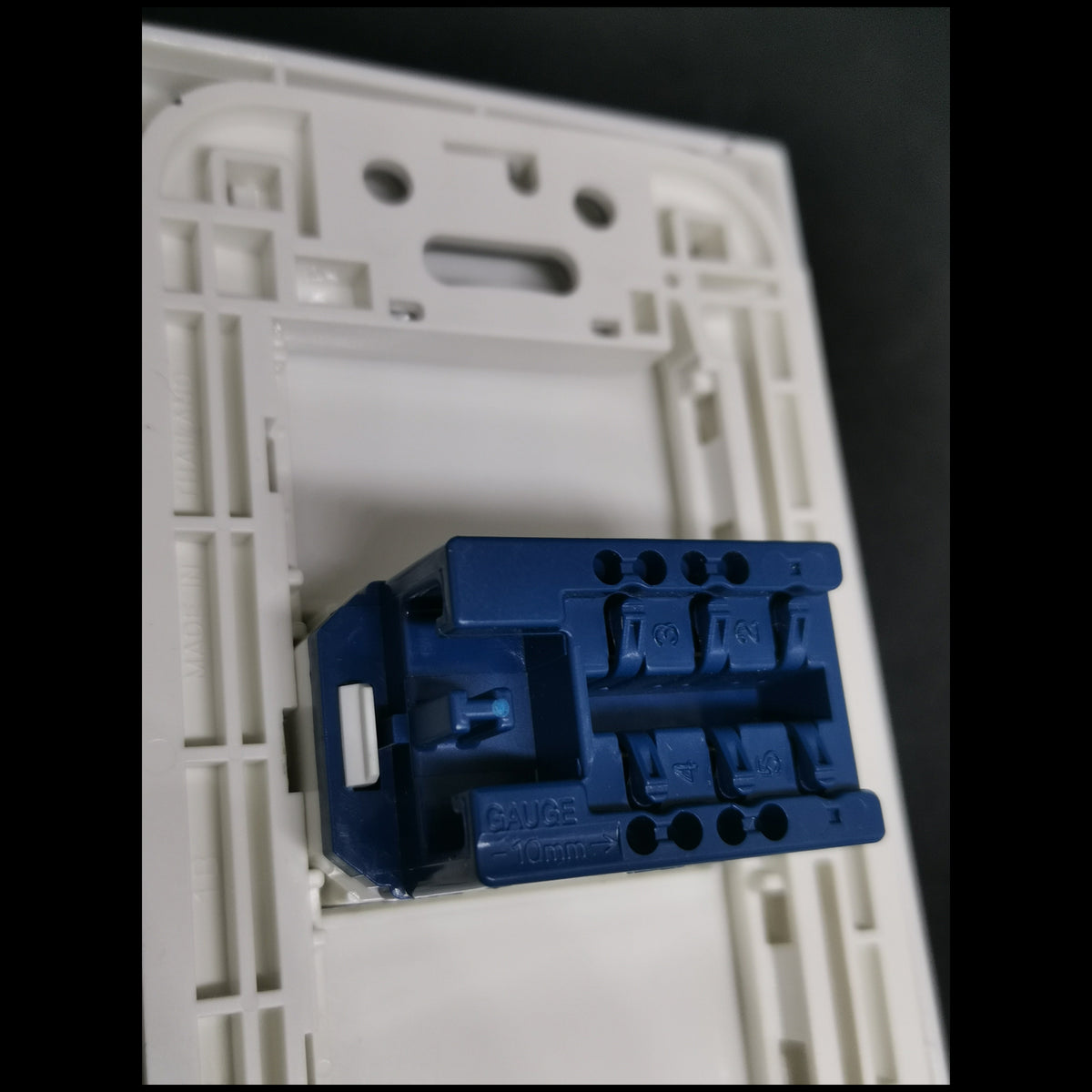 Panasonic Telephone Outlet Wide Series 1 Gang rear view showing blue modular jack mounted in white wall plate