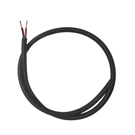 Phelps Dodge perma cord wire with black insulation and exposed copper ends on black background