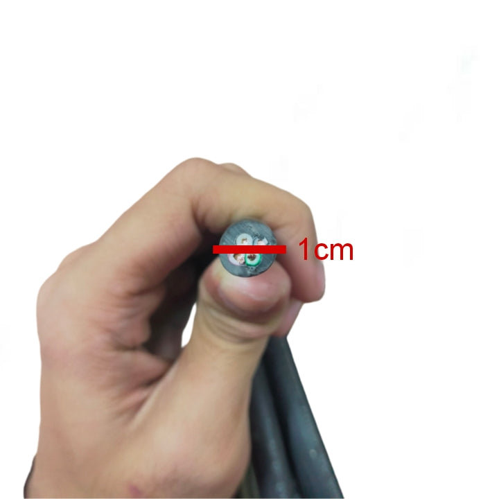 Hand holding Phelps Dodge royal cord 0.75mm 4 core wire with 1cm diameter measurement