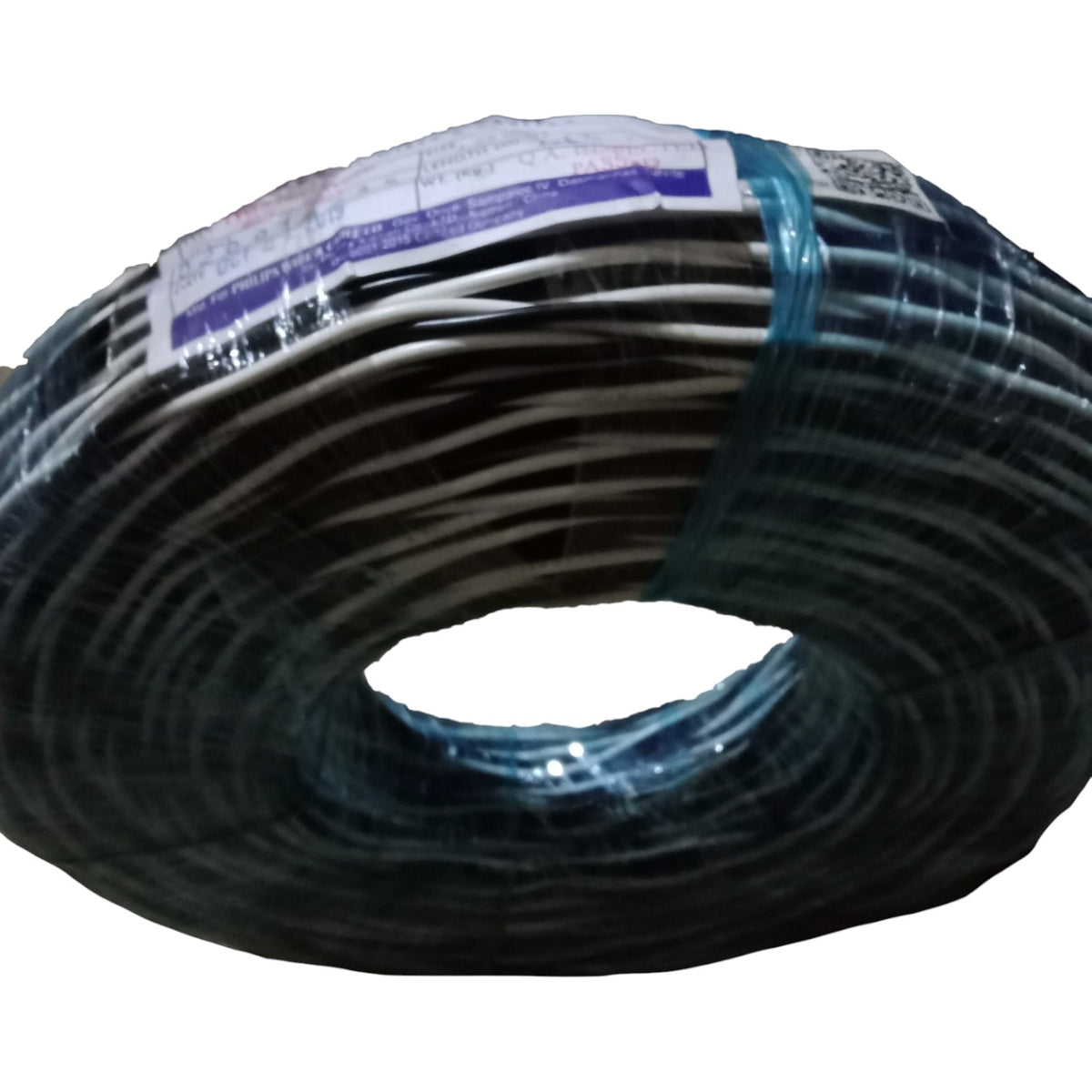 Coiled black cable with a label on a white background