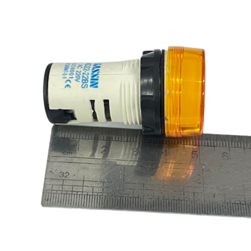 Sassin 22mm LED indicator lamp Yellow panel mount indicator lying on ruler showing size and threaded body