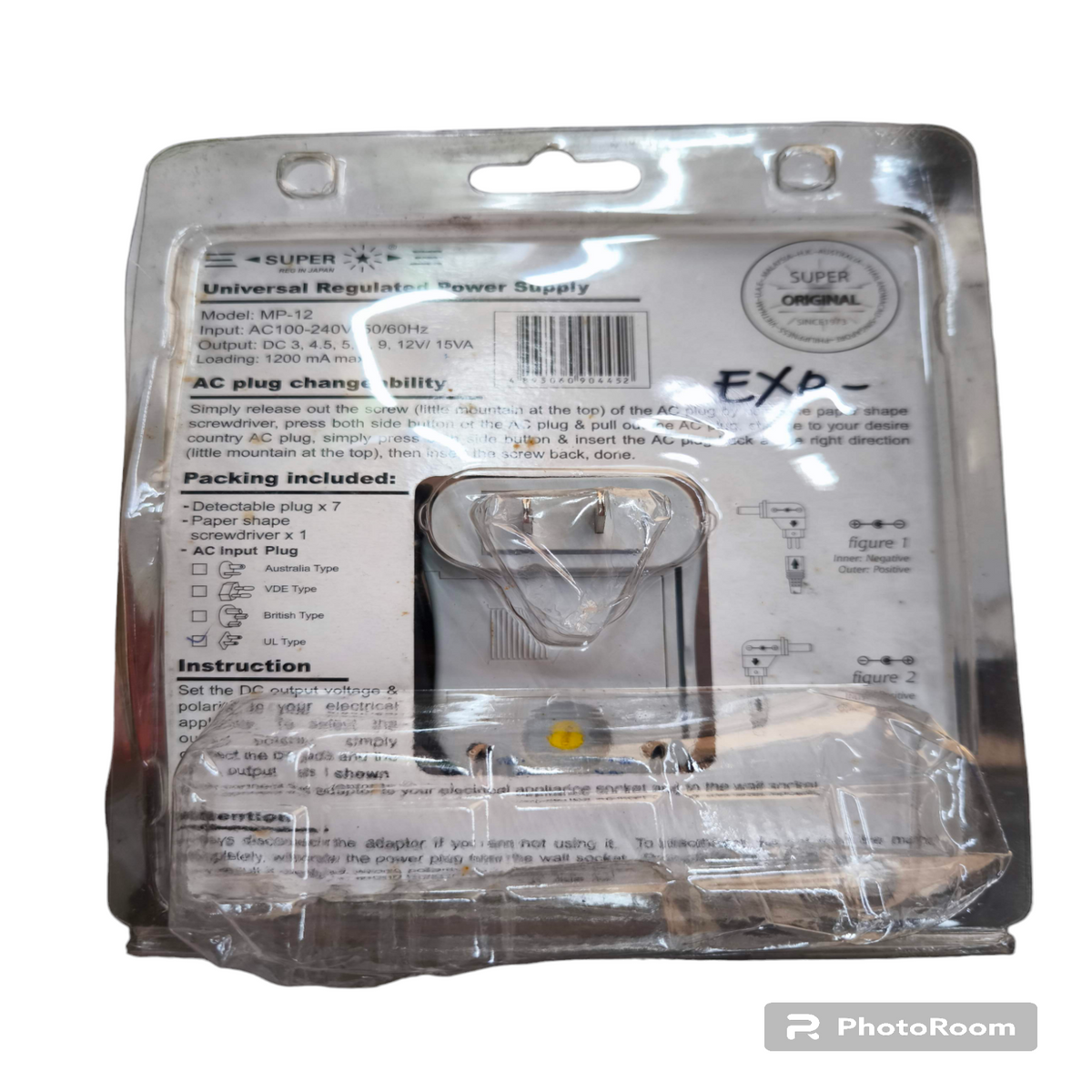 Universal Adaptor 1200mA Output 3V in clear plastic packaging with instructions and label visible