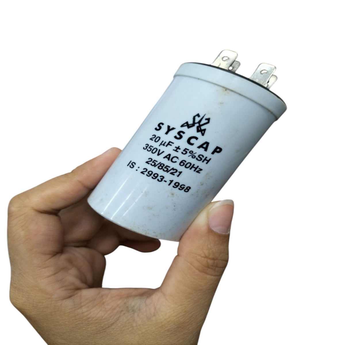 Syscap 20MFD 350 VAC Running Capacitor held in hand showing electrical circuitry part