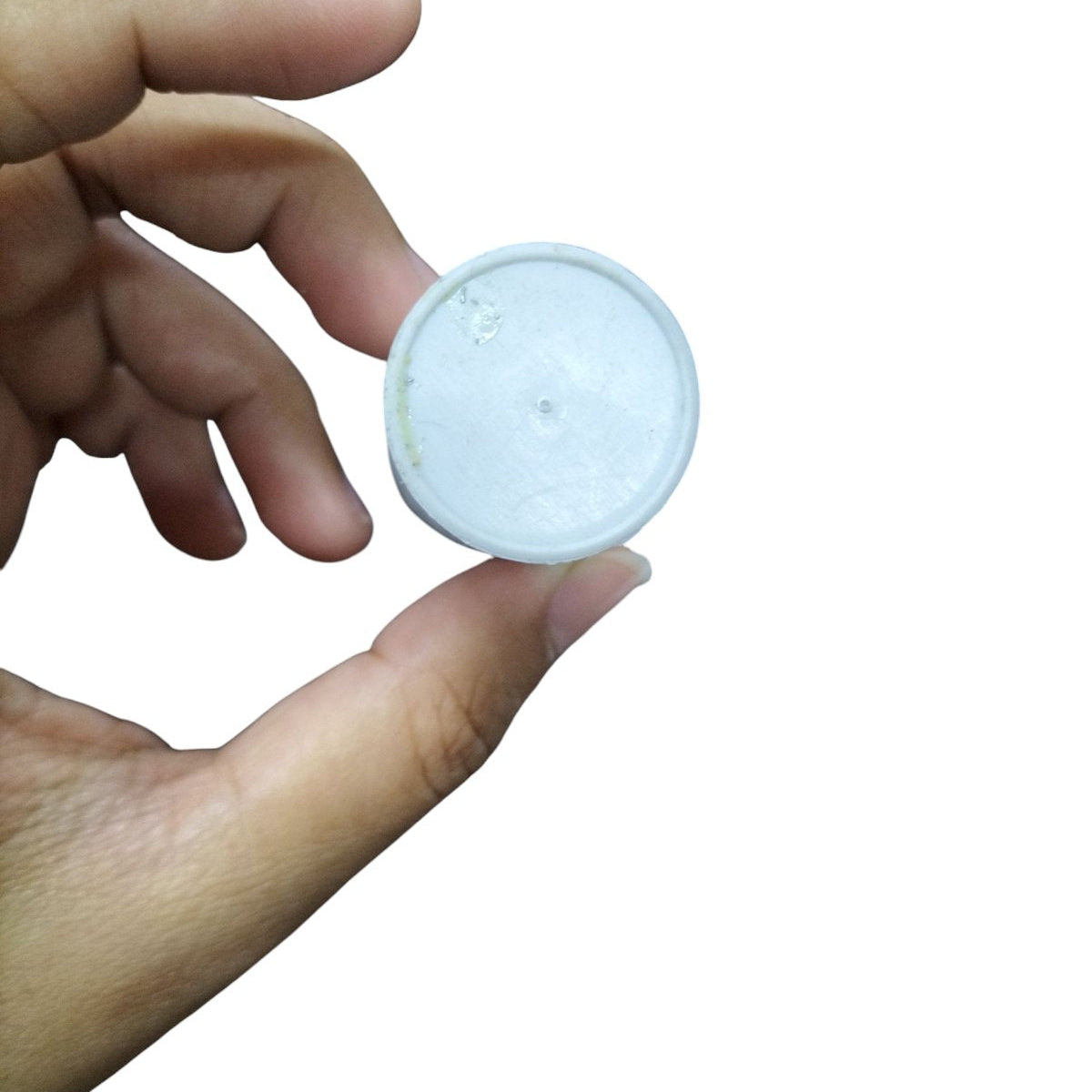 Hand holding a SYSCAP 3MFD 250 VAC Running Capacitor for electrical circuits and parts