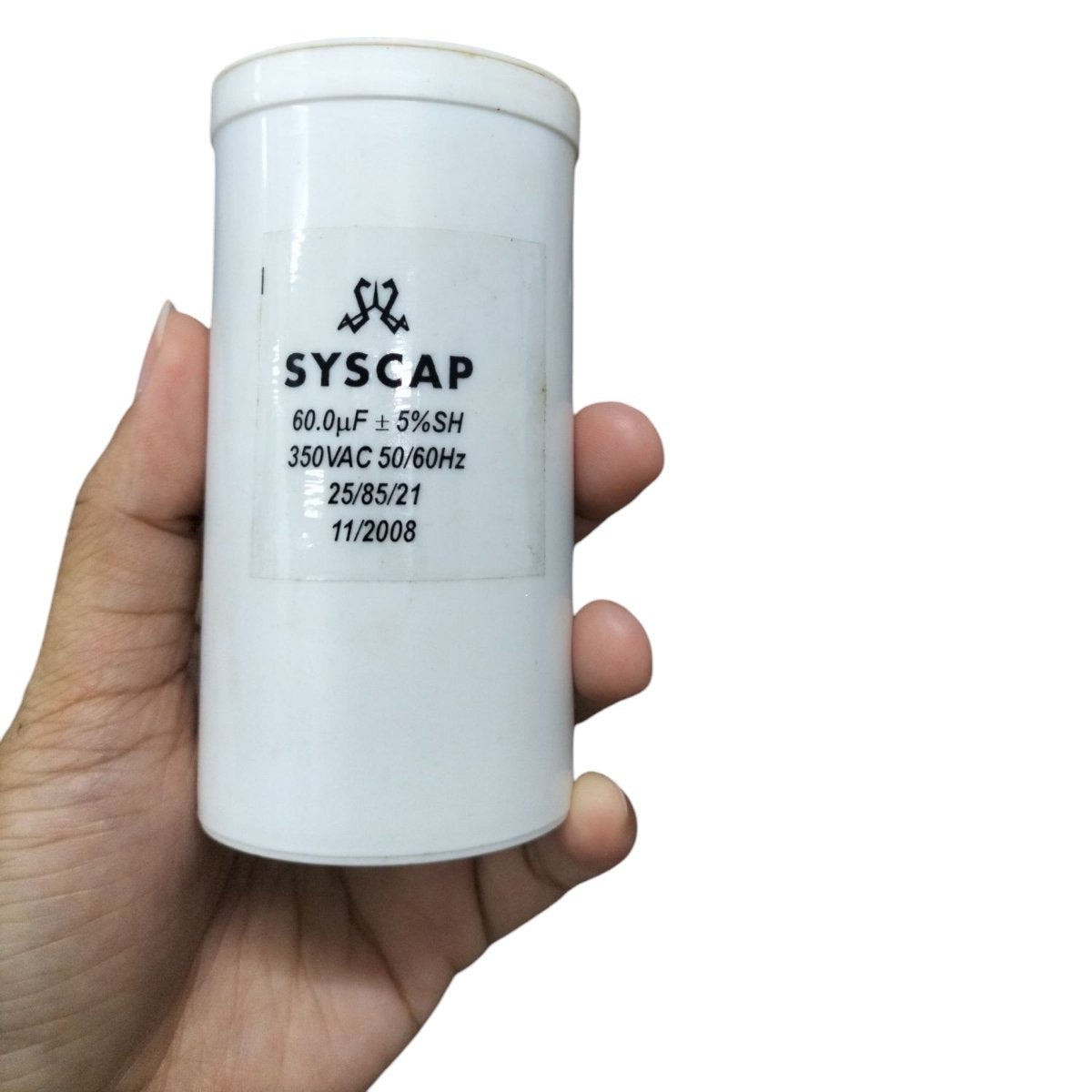 Syscap 60MFD 350V AC Running Capacitor white cylindrical electrical component held in hand