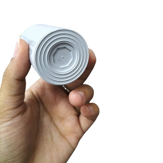 Syscap motor capacitor showing white cylindrical electrical component for circuits