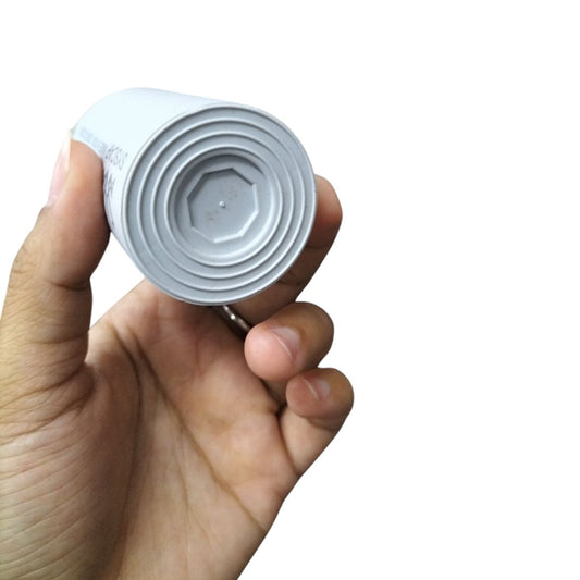 Hand holding a white SYSCAP Motor Running Capacitor 100MFD 450V AC electrical component