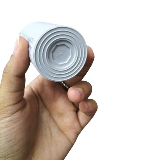 Hand holding SYSCAP motor running capacitor 8MFD 600V AC electrical circuitry part