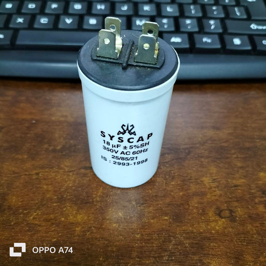 Syscap Running Capacitor 18MFD 350 VAC white cylindrical electrical component on wooden surface