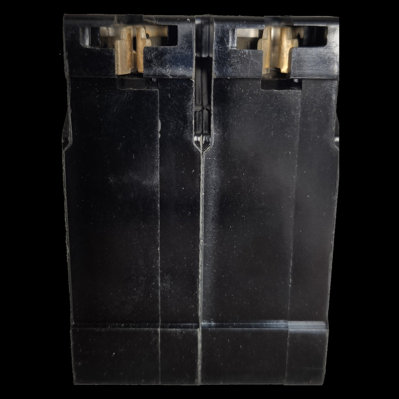 Close-up of Taiyou 15A 2 Pole Circuit Breaker showing black casing and brass connectors