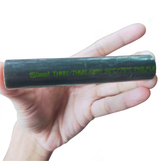 Hand holding a black Philflex THHN Wire 150mm Stranded 300MCM with visible green lettering