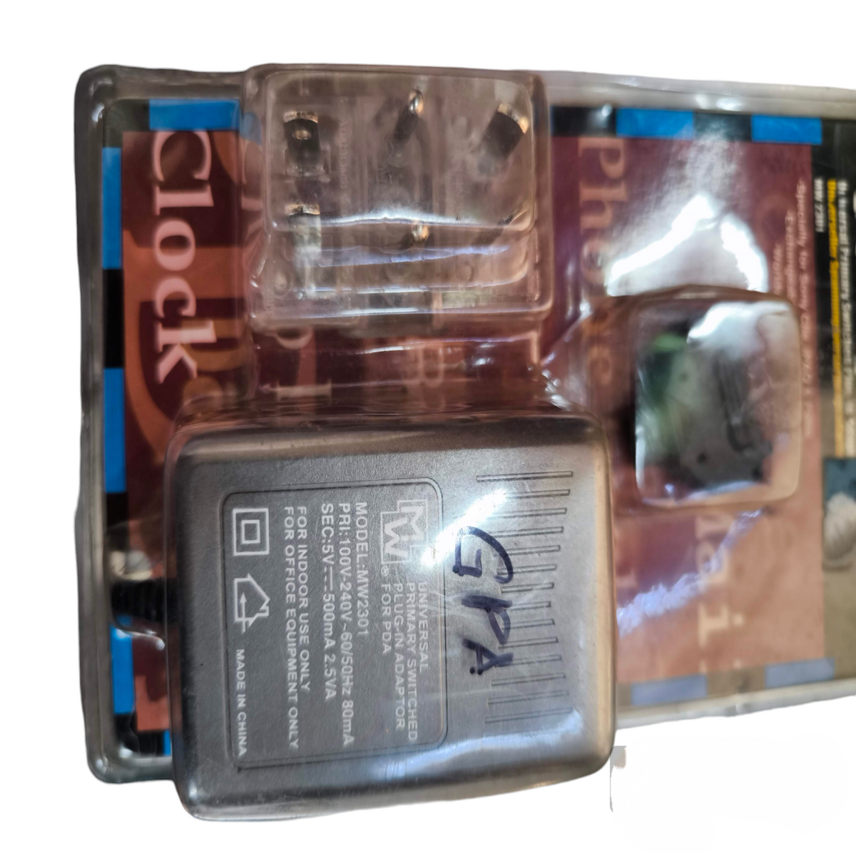 Universal Primary Switching Adaptor in clear plastic packaging for power adaptation and charging