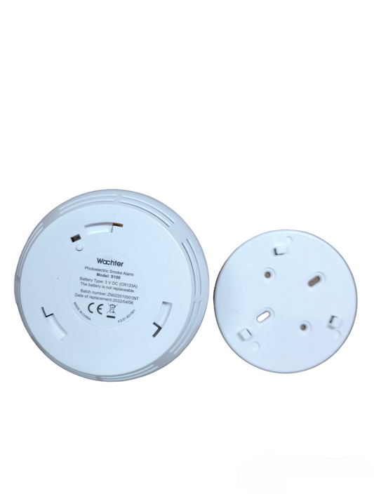 Photoelectric Smoke Alarm Watcher device showing back side with battery compartment and mounting base