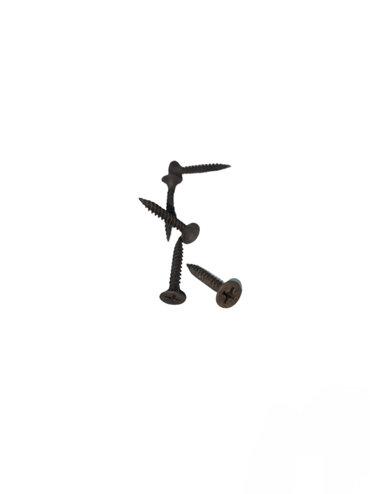 Close-up of black wood screw black philips head screws on white background