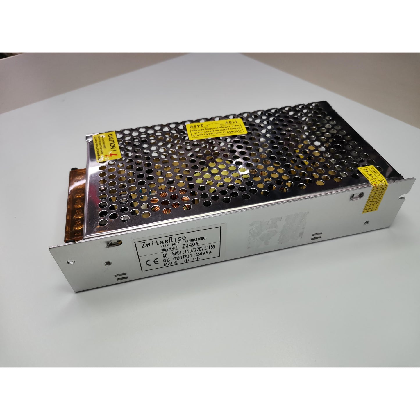 ZwitseRise Power Supply 24V 5A metal casing with ventilation holes on white surface