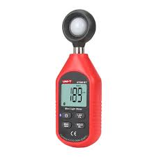 Red digital lux meter measuring light intensity with clear LCD display for accurate illuminance readings