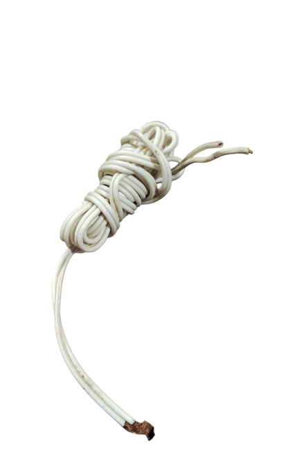 White 1.5 meter pre cut electrical wire with stripped ends coiled on black background