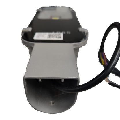 Mechanical component with a black cable on a white background