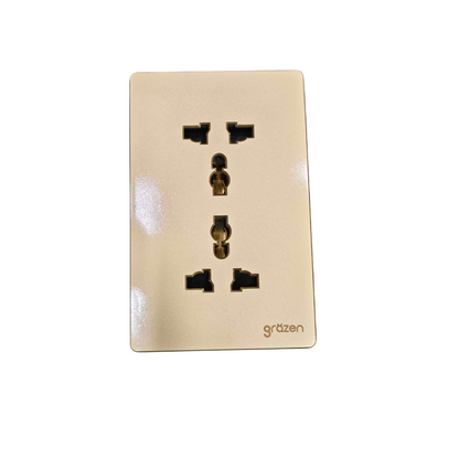A single Deutsch-style three-pin wall outlet cover plate in a warm cream or light beige finish, featuring the 'grützen' brand name printed in the bottom right corner. The glossy surface has minor reflections, and the product is isolated on a white background.