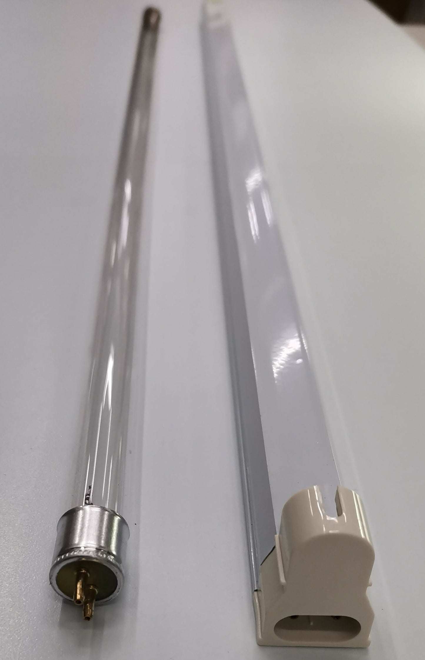14W T-5 UV-C Fluorescent Tube from Firefly and China shown with protective holder on white background