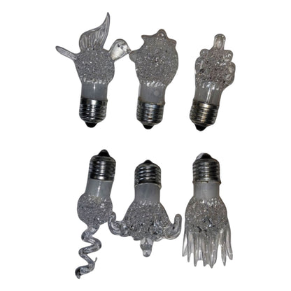 Set of six decorative light bulbs with unique shapes on a white background