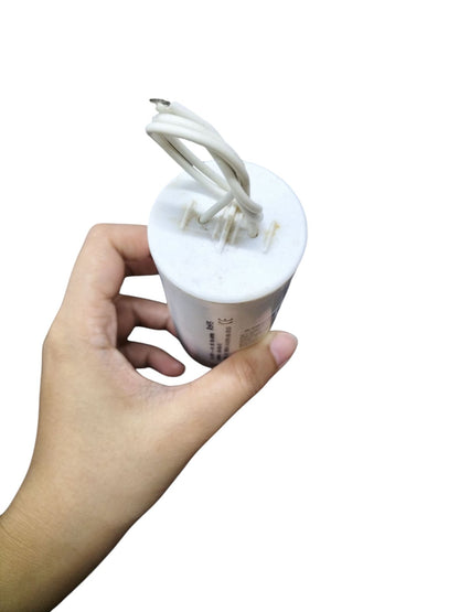 Syscap 20MFD motor running capacitor 600V held in hand, designed for efficient electrical performance