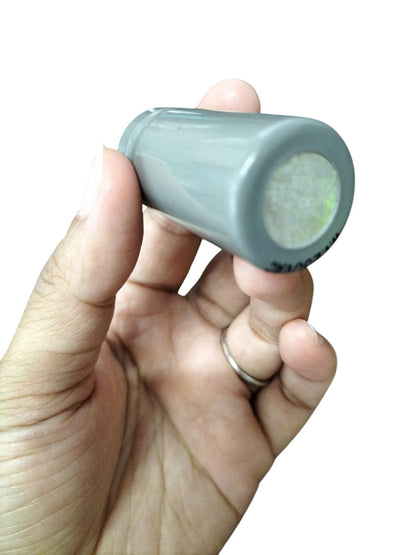 DRE 250 VAC Motor Running Capacitor held in hand, showcasing its compact and cylindrical design