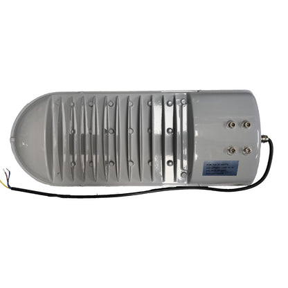 Gray industrial device with ribbed surface and visible wiring on a white background