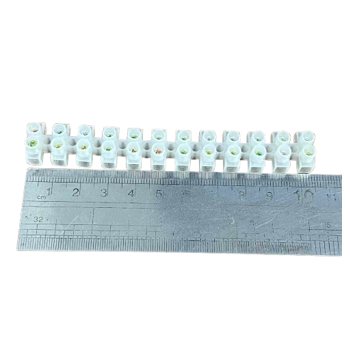 Grippes 5A PVC terminal block 12 pairs shown with a ruler for size reference
