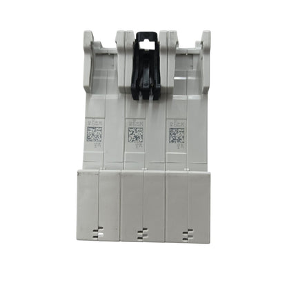 A three-phase electrical terminal block connector with gray plastic housing and a black central locking tab, shown on a plain white background.