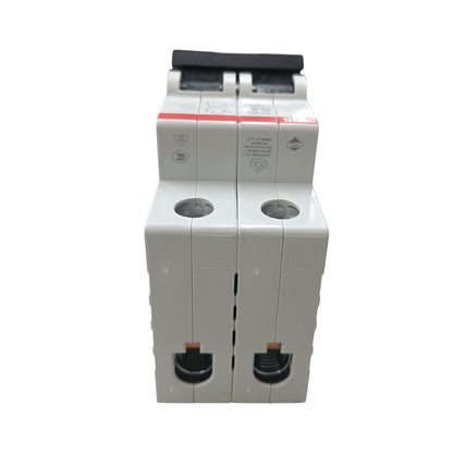 A two-pole modular circuit breaker with a white plastic housing, black switch handles, and a red label strip on a plain white background.