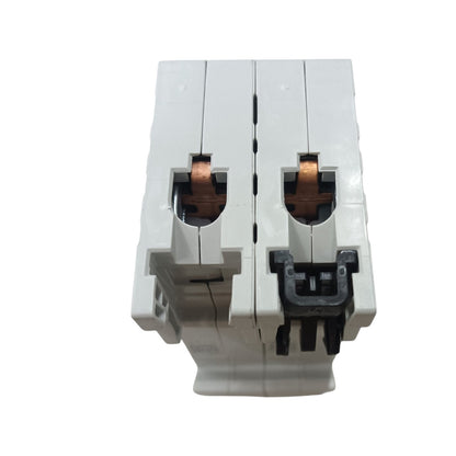 A white double-pole modular electrical circuit breaker with copper-colored internal contacts and a black plastic latch, shown against a plain white background.