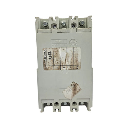 A heavy-duty industrial contactor relay with a gray plastic housing, featuring terminal blocks at the top and bottom, a worn paper label with numbers, and a small sticker near the bottom, shown against a plain white background.
