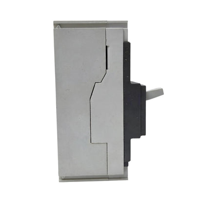 A close-up of a metallic silver and black mechanical component or switch assembly on a plain white background.