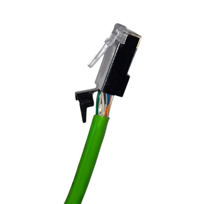 Close-up of a green Ethernet cable connector with a black RJ45 plug, clear protective cover, and visible internal multicolored wires on a white background.