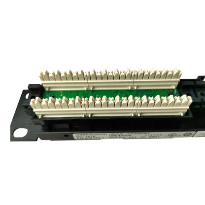 A black automotive electronic control module with multiple beige terminal connectors arranged in two rows over a green circuit board, shown on a plain white background.