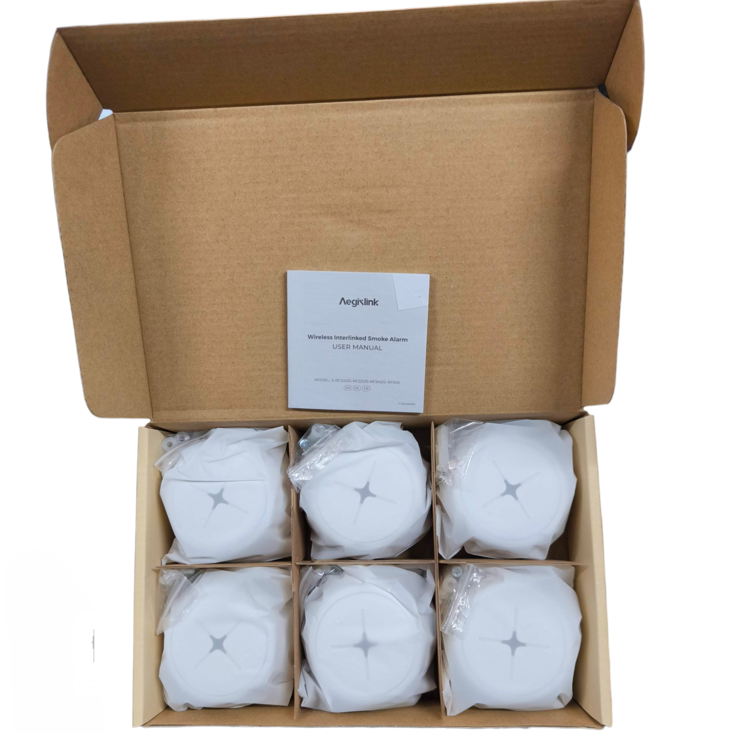 Aegislink wireless interlinked smoke alarm set with six white alarms neatly packed in an open box