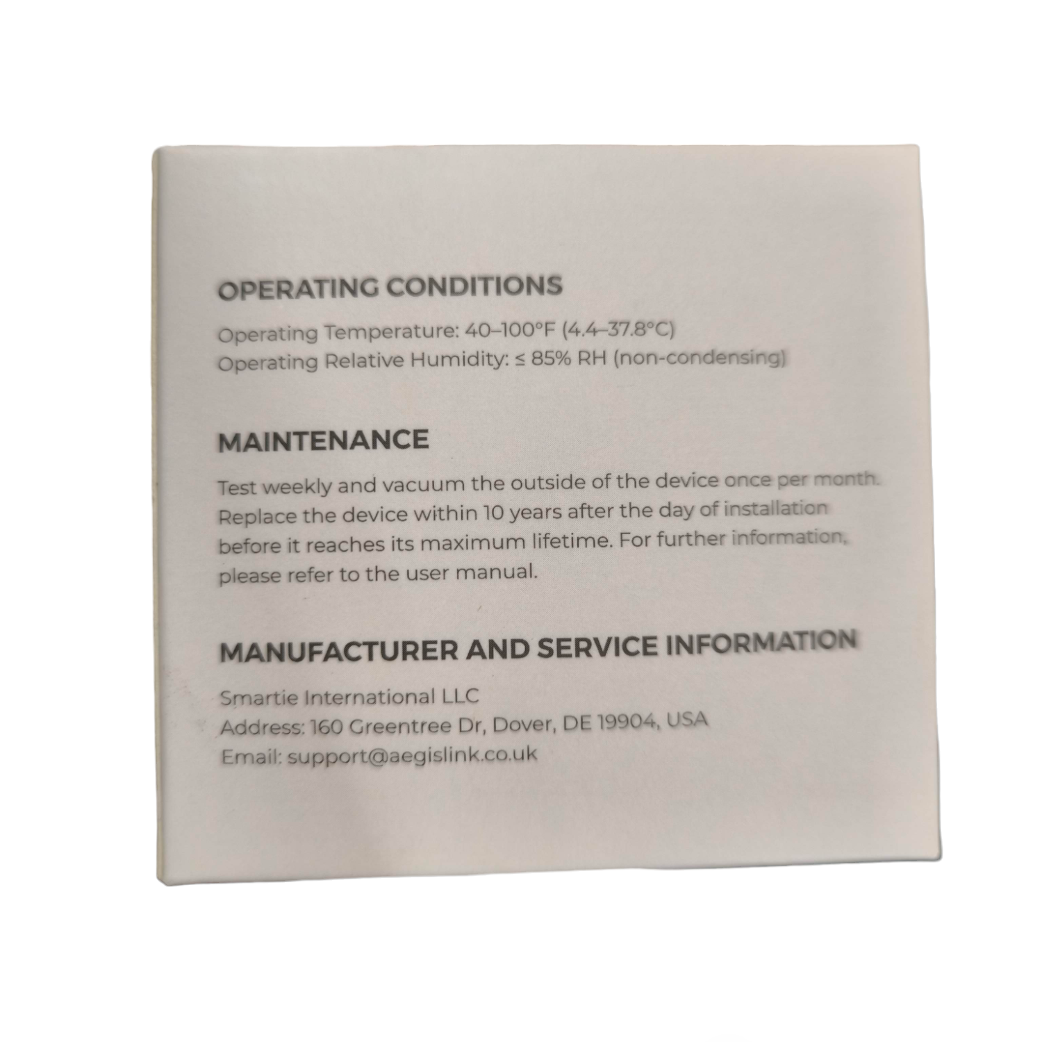 Aegislink wireless interlinked smoke alarm label showing operating conditions and maintenance instructions
