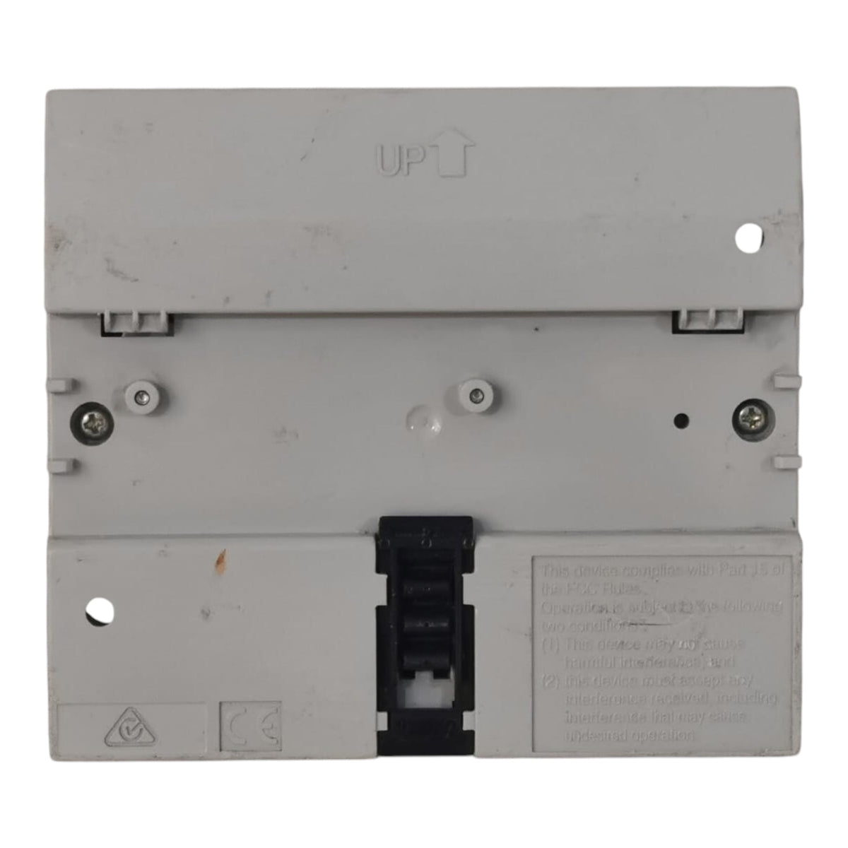 A light gray plastic electrical component or terminal block with a black central connector cover, photographed against a plain white background.