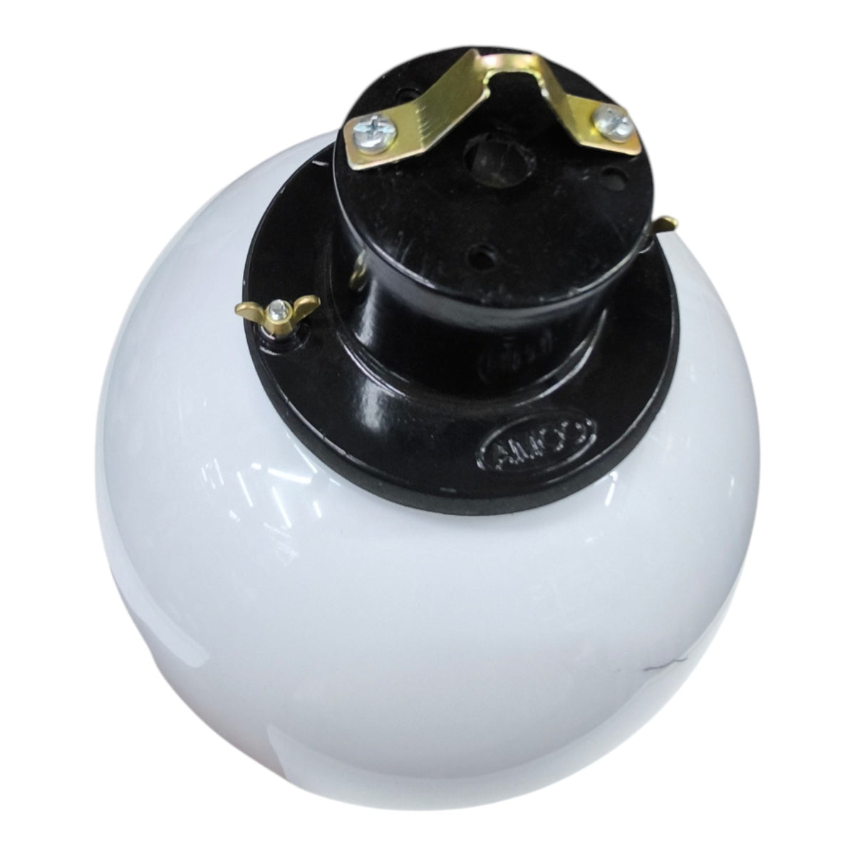 A white globe-style light fixture with a black top canopy and brass-colored metal contacts, shown on a plain white background.