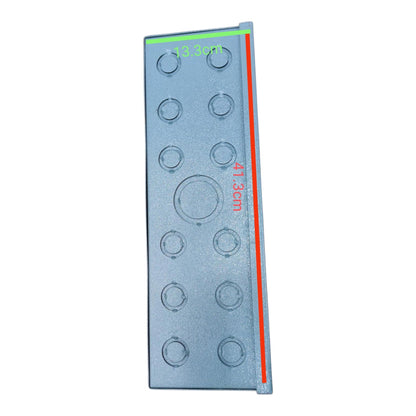 A rectangular gray plastic component with circular cutouts, overlaid with green and red measurement lines and red text indicating dimensions, on a plain white background.