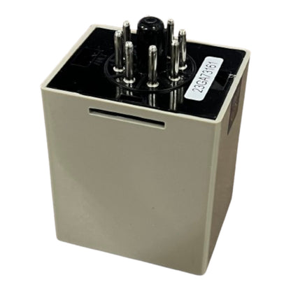 Rectangular electronic component with metallic pins on a white background