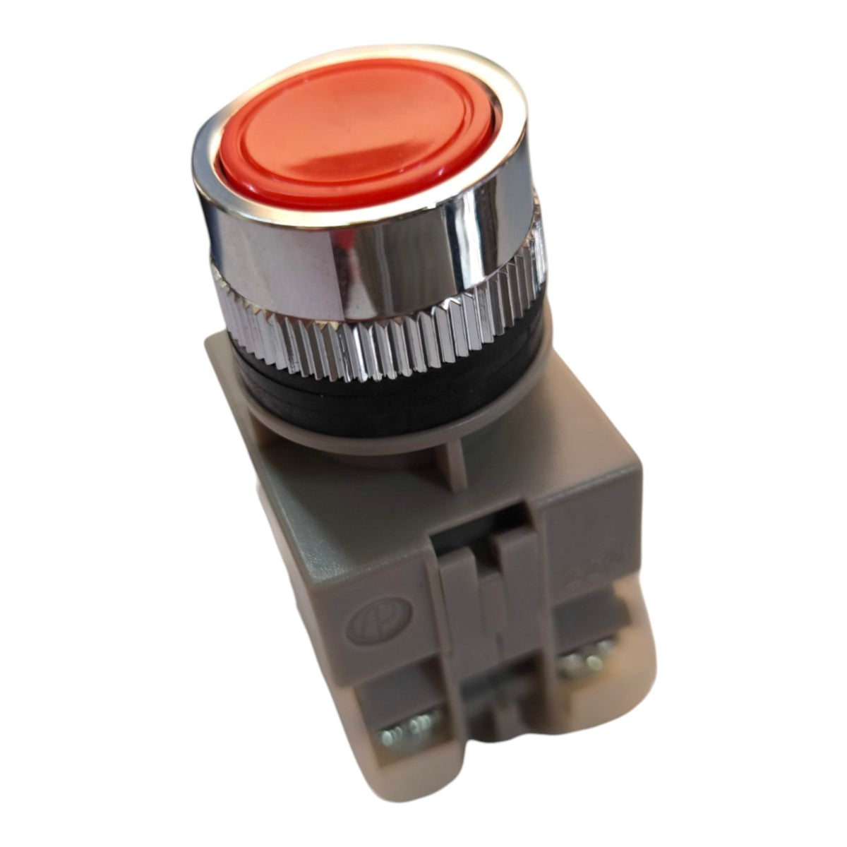 An industrial push button with a red oval button face, a shiny chrome ribbed bezel, and a gray plastic housing, shown on a plain white background.