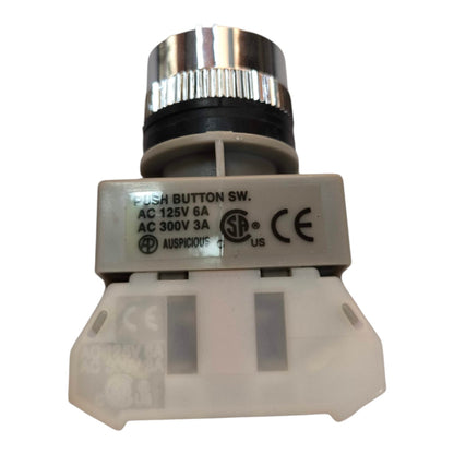 A small industrial push button switch assembly with a silver metal top, black ring, white plastic housing, and printed technical specifications on the side.