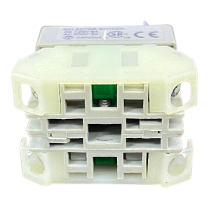 A plastic selector switch with three stacked positions, featuring a cream-colored outer housing and a white top cover with technical specifications and CE/SB marks.