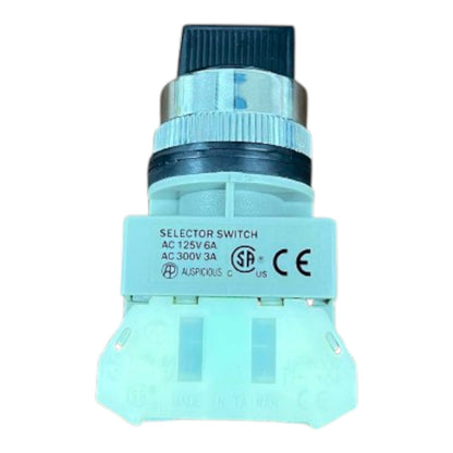 A light blue plastic industrial selector switch with a black and silver threaded connector, featuring printed specifications and certification logos on its side.