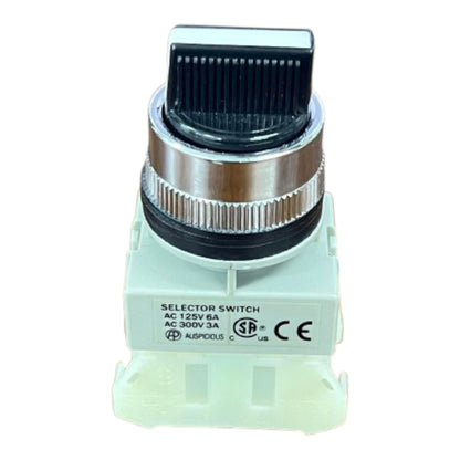 An industrial electrical selector switch with a black ribbed knob, a silver metal collar, and a light green plastic base, shown against a plain white background.