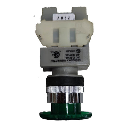An industrial electrical push button assembly with a green base, a silver and black ribbed metal stem, a gray housing, and a cream-colored plastic top connector block. The button is labeled 'EMERGENCY PUSH BUTTON' with technical specifications, and the top has a white sticker reading '220V'.