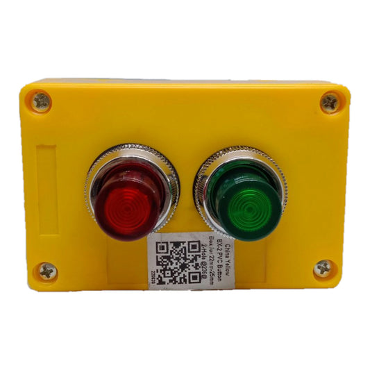 A yellow industrial control panel featuring two prominent push buttons: a red emergency stop button on the left and a green start button on the right, both with silver metal bezels. A white QR code label is affixed below the buttons.