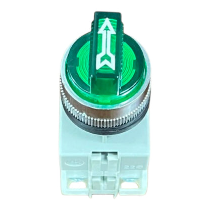 A green and white electrical push-button switch with a circular textured ring and a white arrow symbol on the top cover, isolated on a white background.